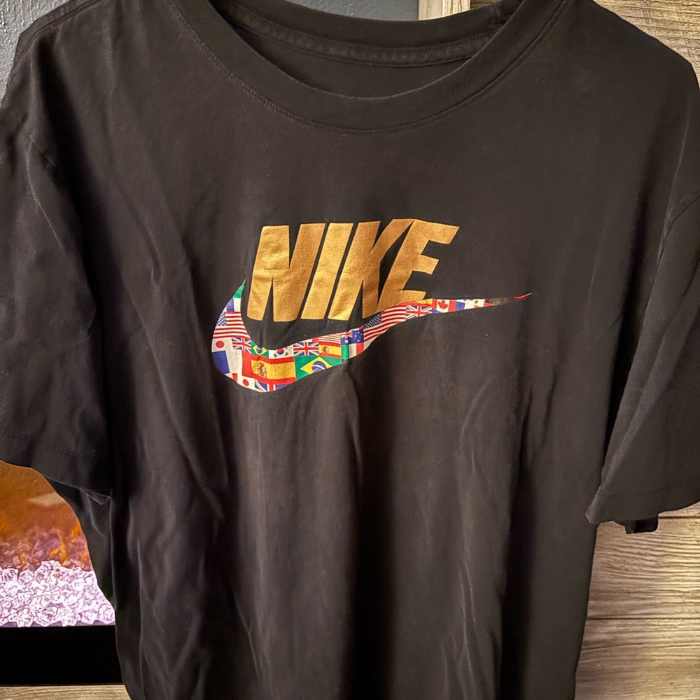 Nike Black Tee with Gold & flag Logo